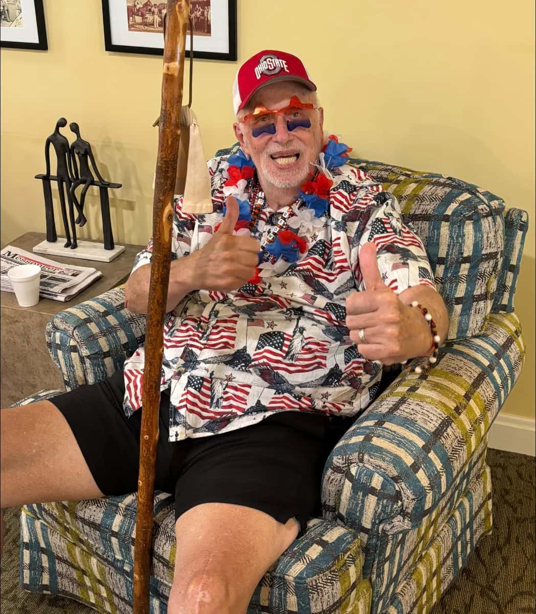 Resident celebrating Independence Day with patriotic attire at Grove City Senior Living